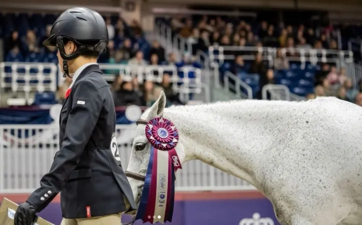 Young rider with a first place ribbon at the Royal Winter Fair horse show